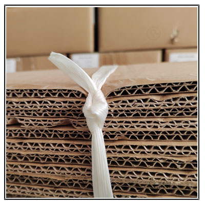 Baler strapping